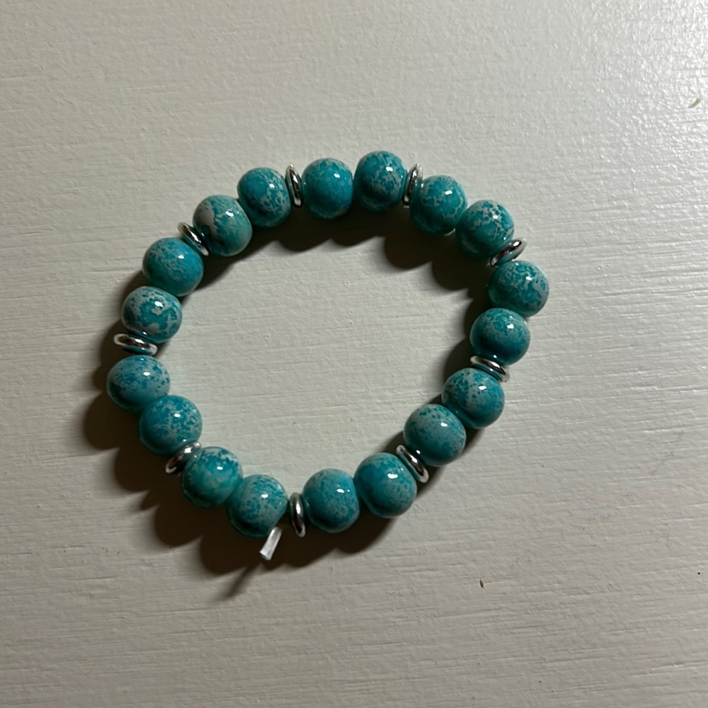 Kids blue with silver accent beads stretchy bracelet. Measure 2.5” Gently used.